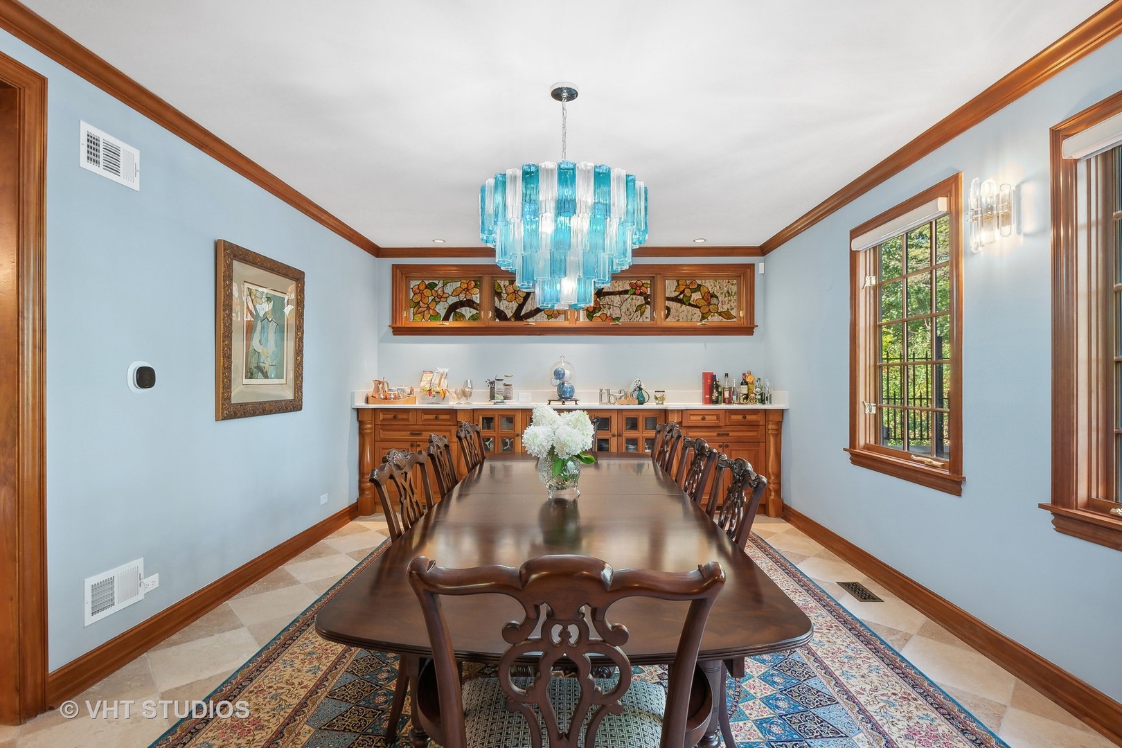 305 Central Avenue Wilmette, IL 60091 - Photo 10 of 42 a view of a dining room with furniture a chandelier and wooden floor