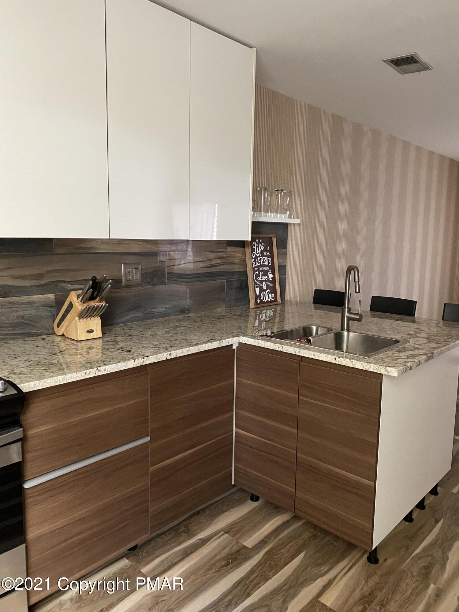 3315 Windemere Drive Bushkill, PA 18324 - Photo 17 of 55 a kitchen with a sink and cabinets