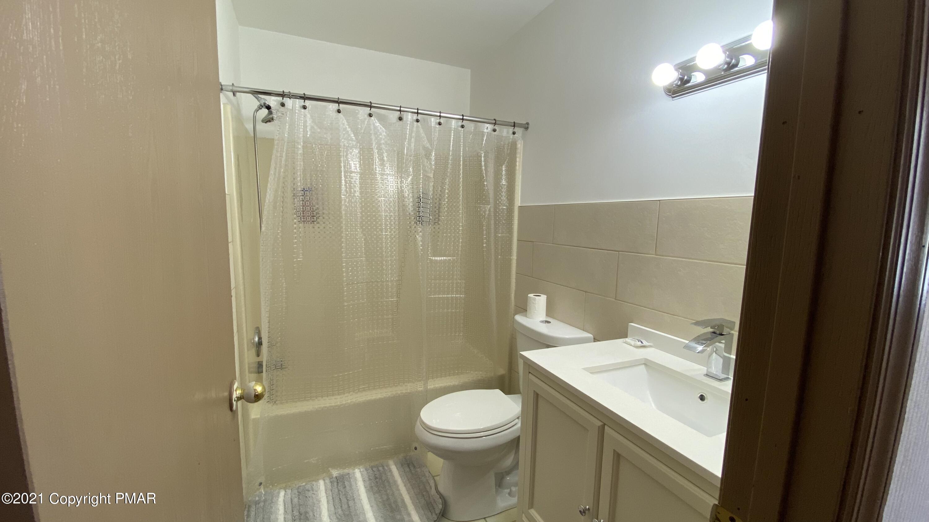 3315 Windemere Drive Bushkill, PA 18324 - Photo 21 of 55 a bathroom with a sink toilet and shower