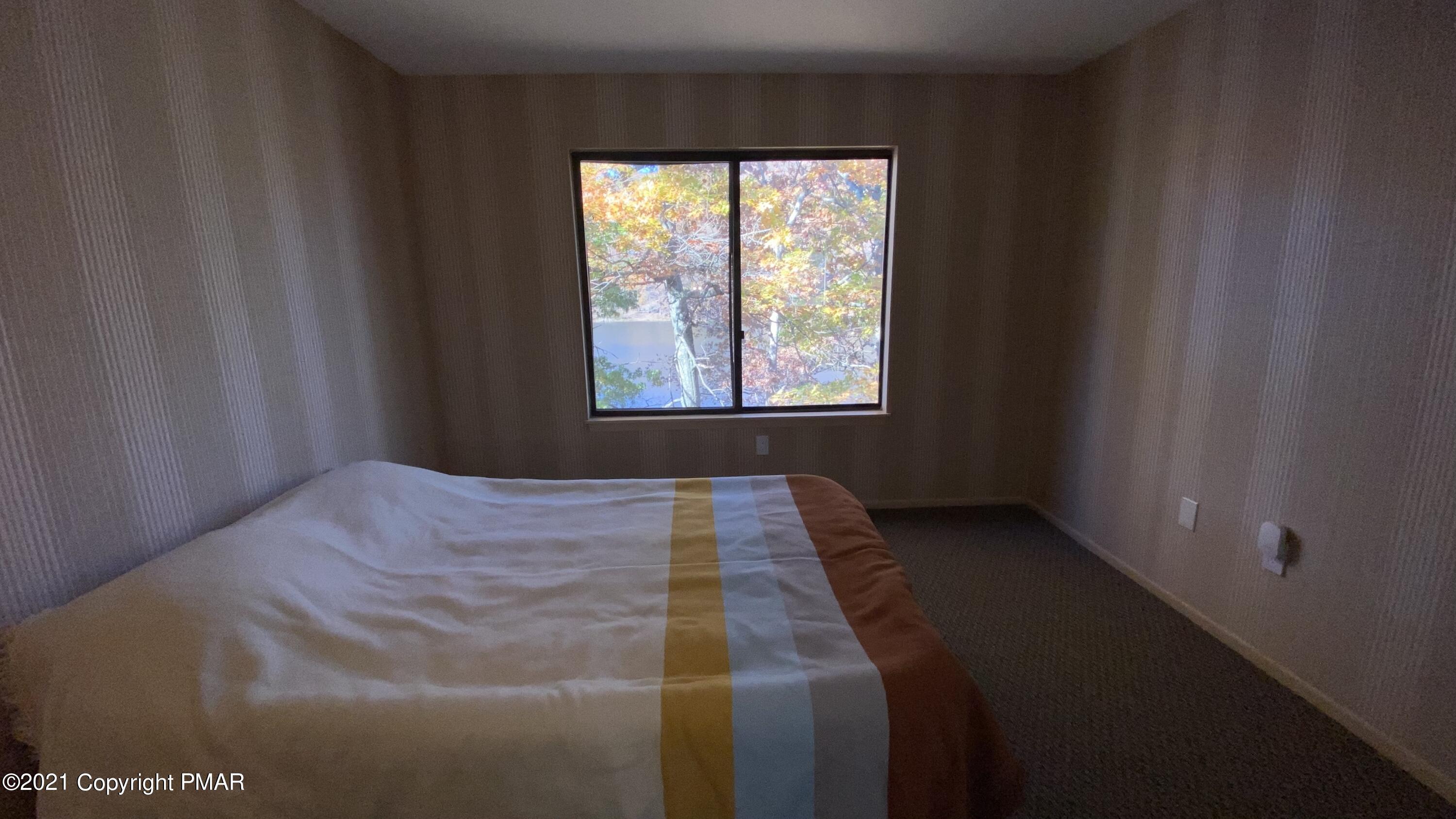 3315 Windemere Drive Bushkill, PA 18324 - Photo 22 of 55 a bedroom with a bed and window