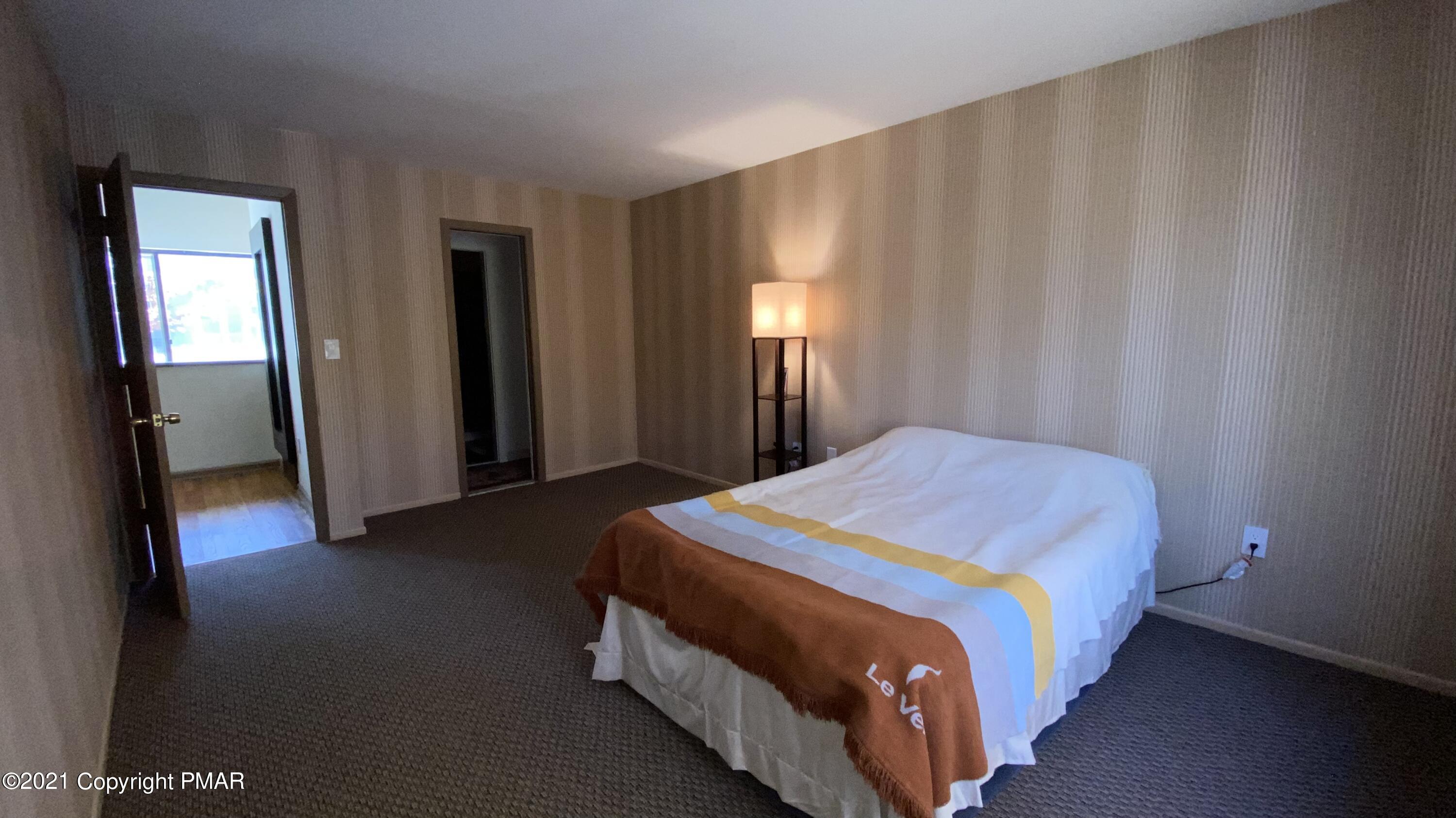 3315 Windemere Drive Bushkill, PA 18324 - Photo 23 of 55 a bedroom with a bed and a window