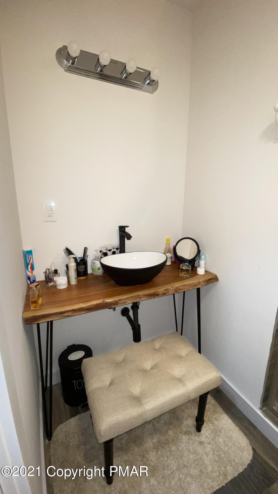 3315 Windemere Drive Bushkill, PA 18324 - Photo 26 of 55 a bathroom with a sink and a mirror