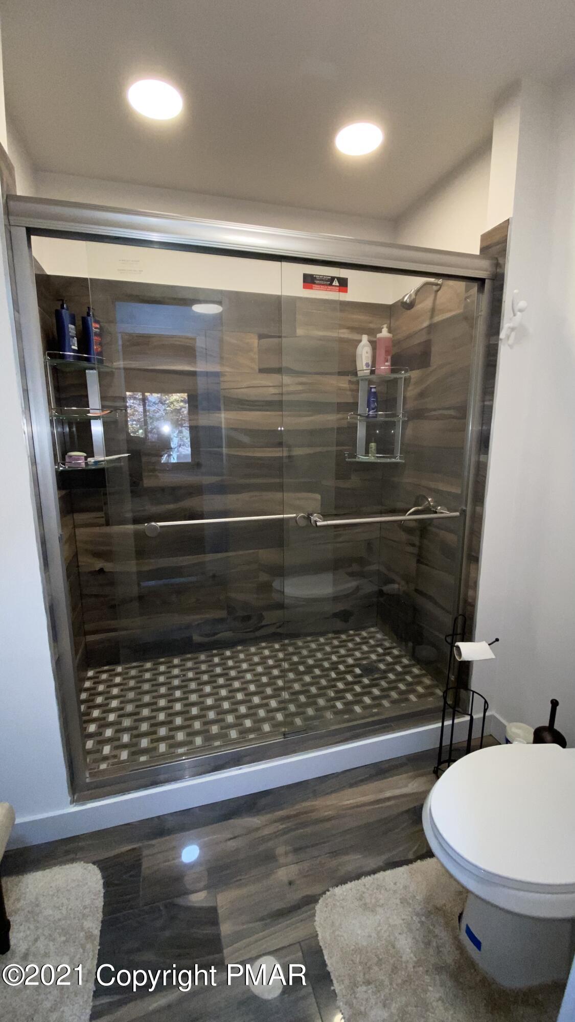 3315 Windemere Drive Bushkill, PA 18324 - Photo 29 of 55 a bathroom with a toilet and a shower