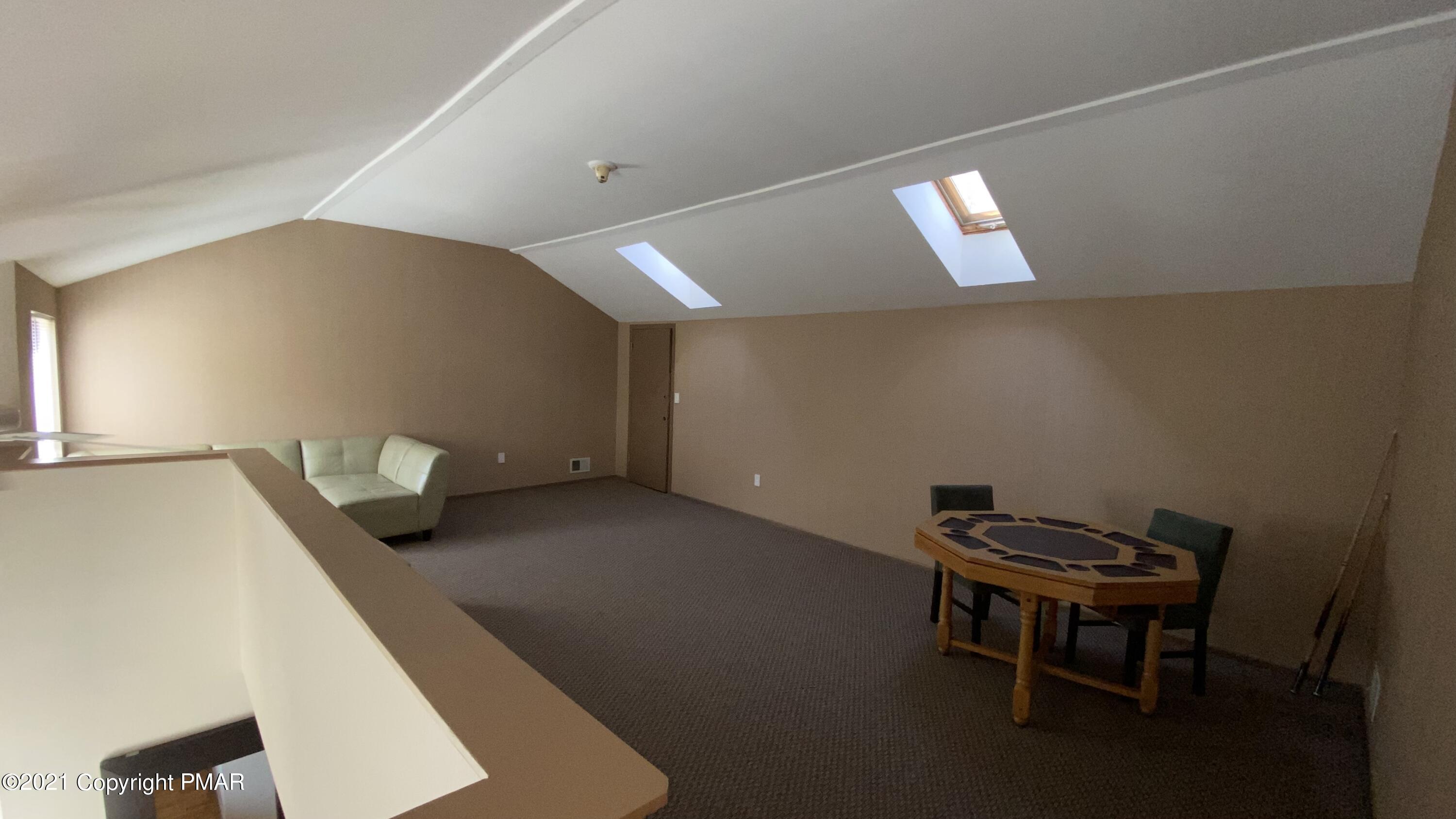 3315 Windemere Drive Bushkill, PA 18324 - Photo 32 of 55 a living room with furniture and a window