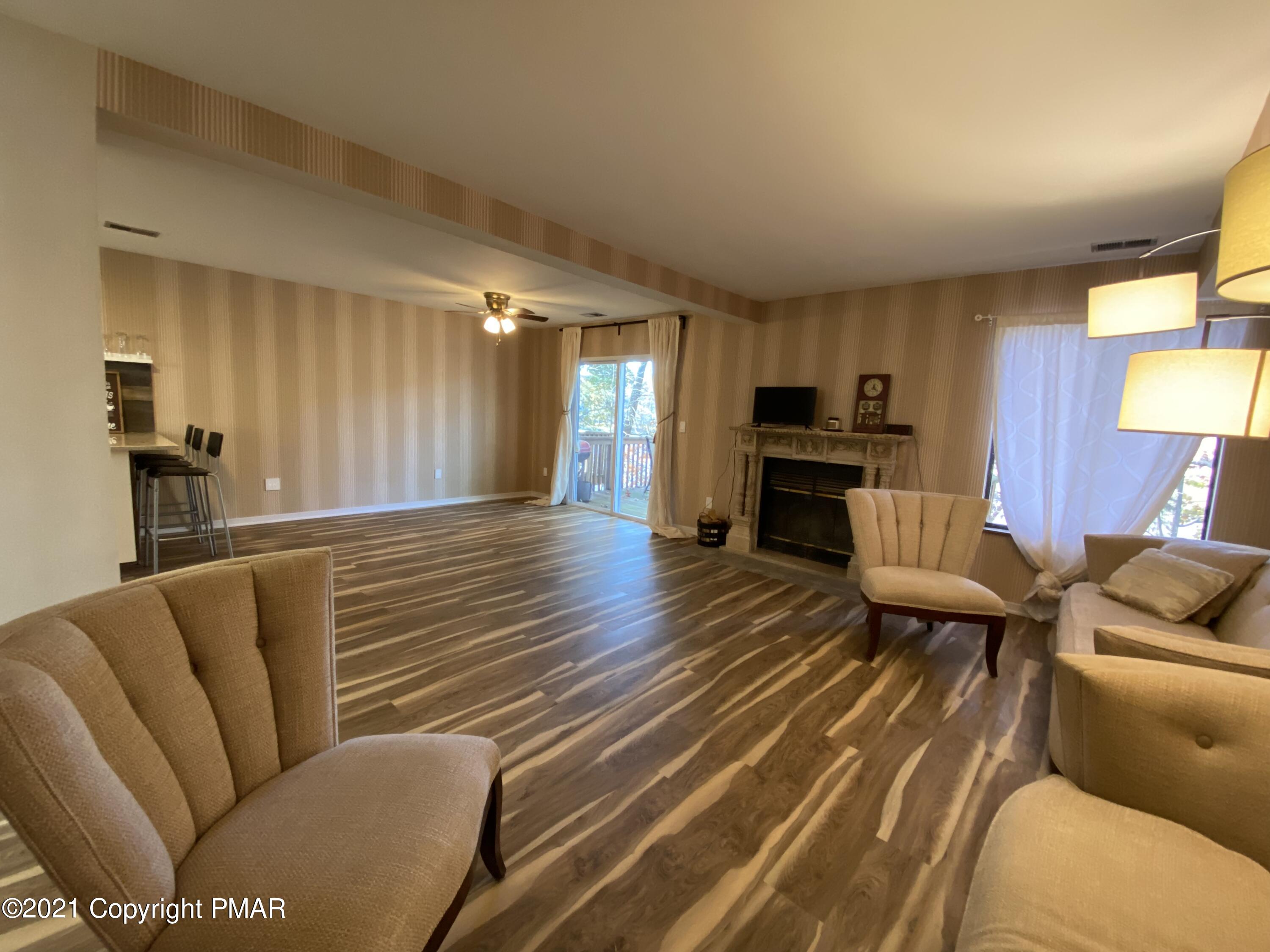 3315 Windemere Drive Bushkill, PA 18324 - Photo 9 of 55 a living room with furniture and a wooden floor