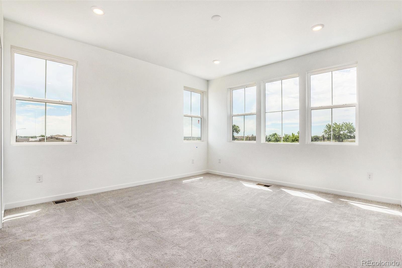 874 Furrow Way Lafayette, CO 80026 - Photo 11 of 27 an empty room with windows