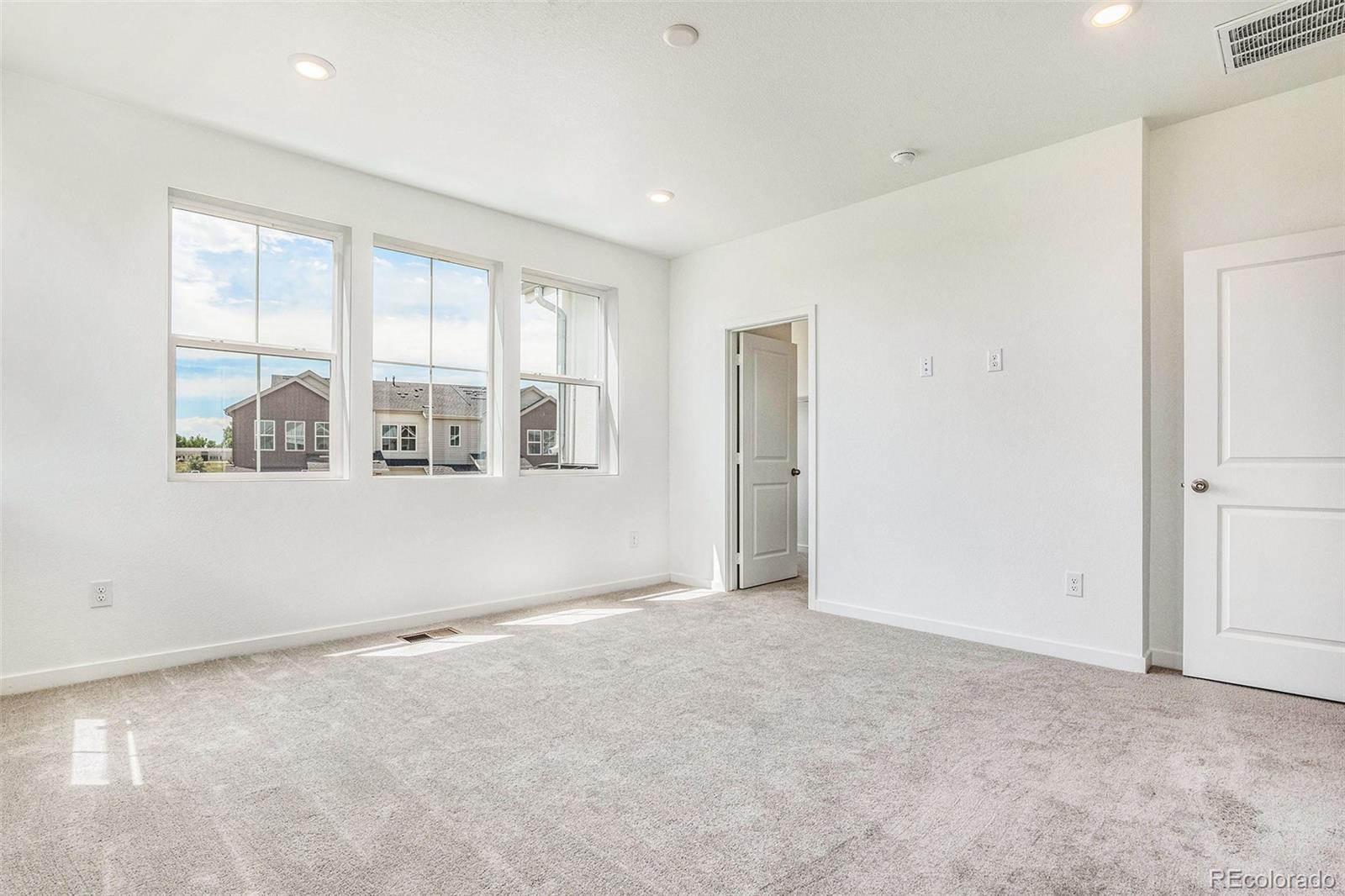 874 Furrow Way Lafayette, CO 80026 - Photo 12 of 27 an empty room with windows