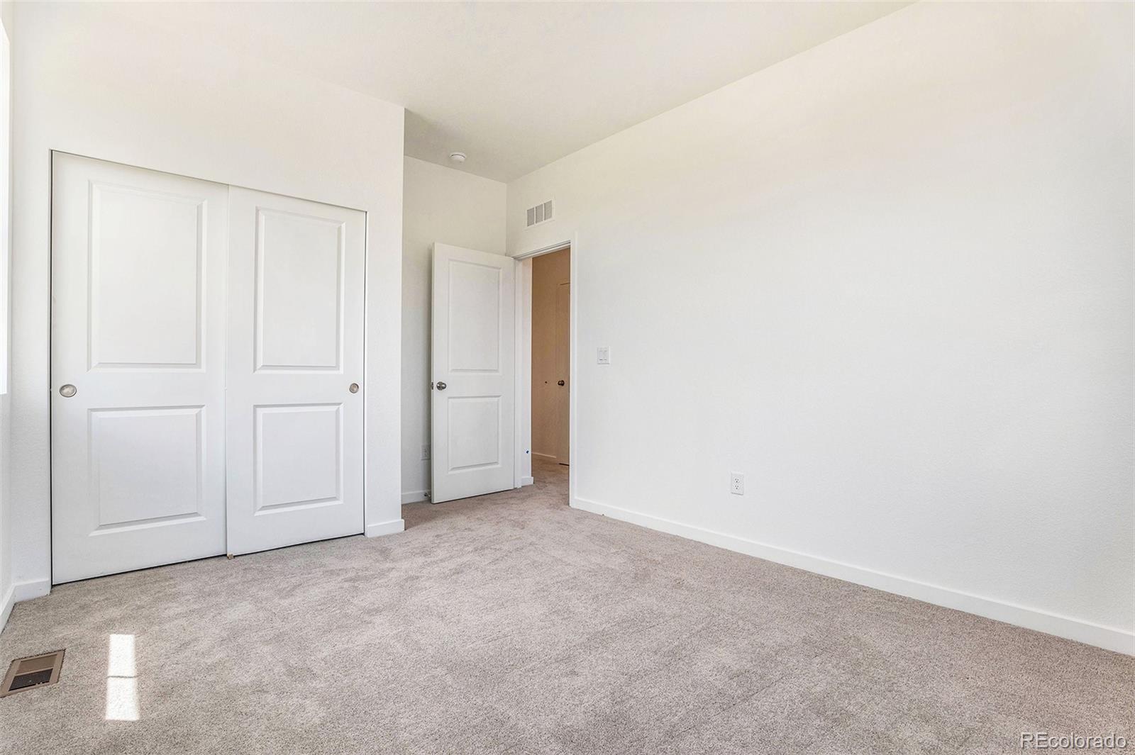 874 Furrow Way Lafayette, CO 80026 - Photo 4 of 27 an empty room with closet area