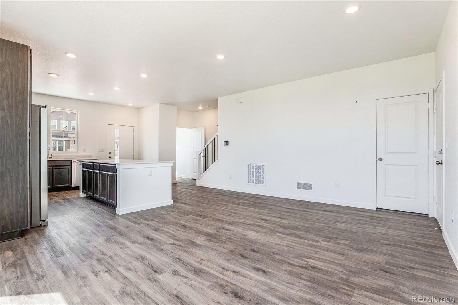 874 Furrow Way Lafayette, CO 80026 - Photo 5 of 27 a view of kitchen with wooden floor