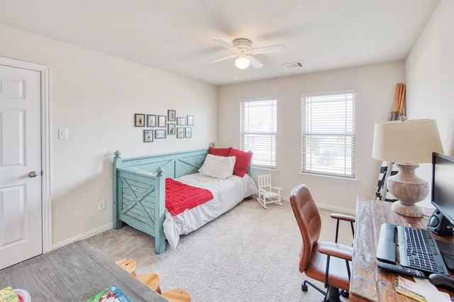 a bedroom with furniture and a window