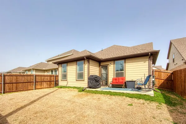 a view of a house with a yard and garage