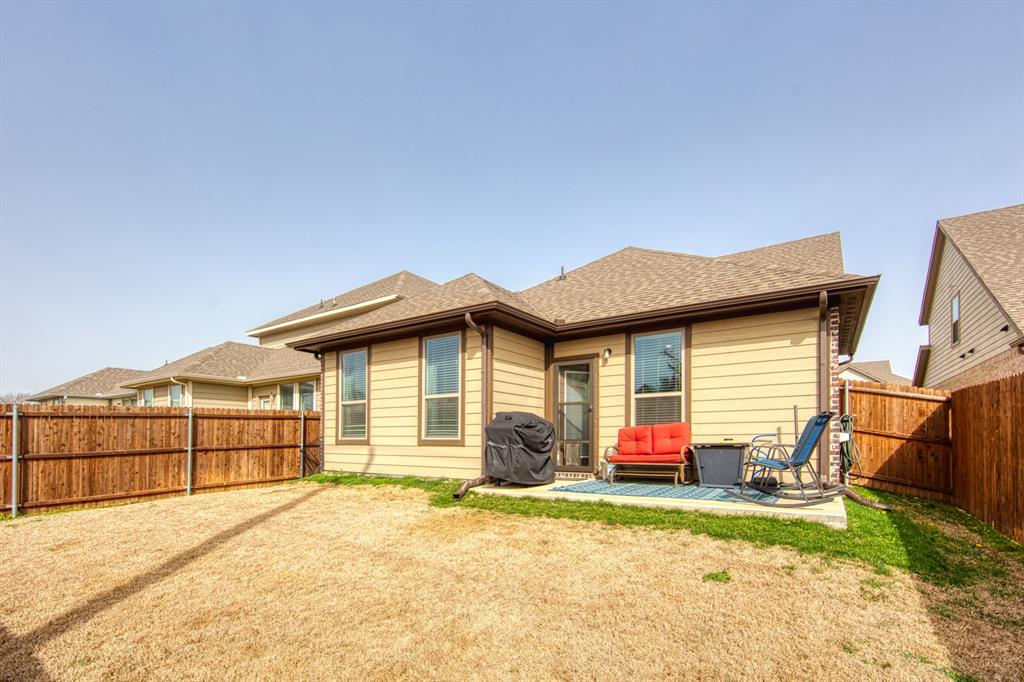 145 Cole Road Pilot Point, TX 76258 - Photo 13 of 14 a view of a house with a yard and garage