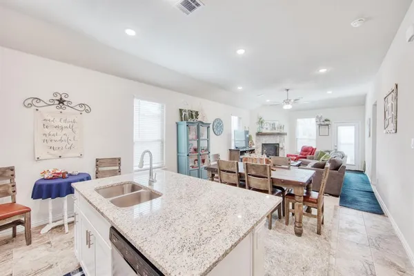 a view of a dining room with furniture and a chandelier