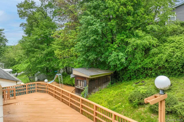 a view of a chairs and tables in the backyard