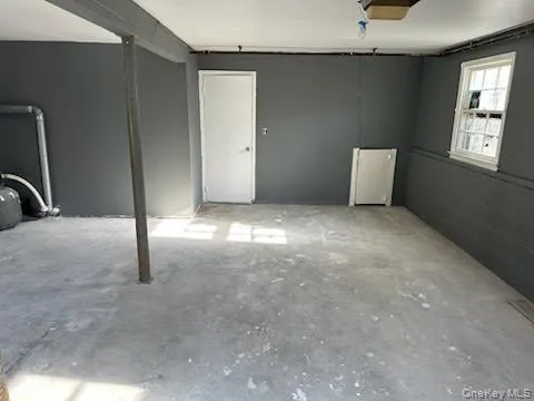 a view of an empty room with windows