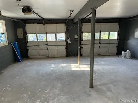 a view of an empty room with windows