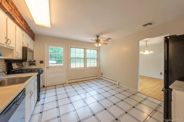 a view of a kitchen with a sink