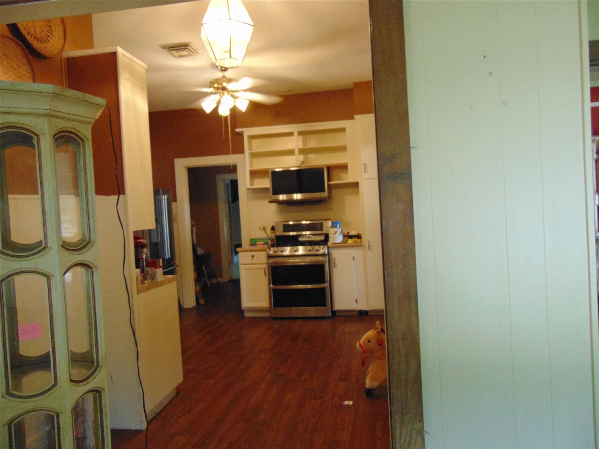 100 West Caroline Street Trinity, TX 75862 - Photo 14 of 28 a kitchen with stainless steel appliances a refrigerator and a stove top oven
