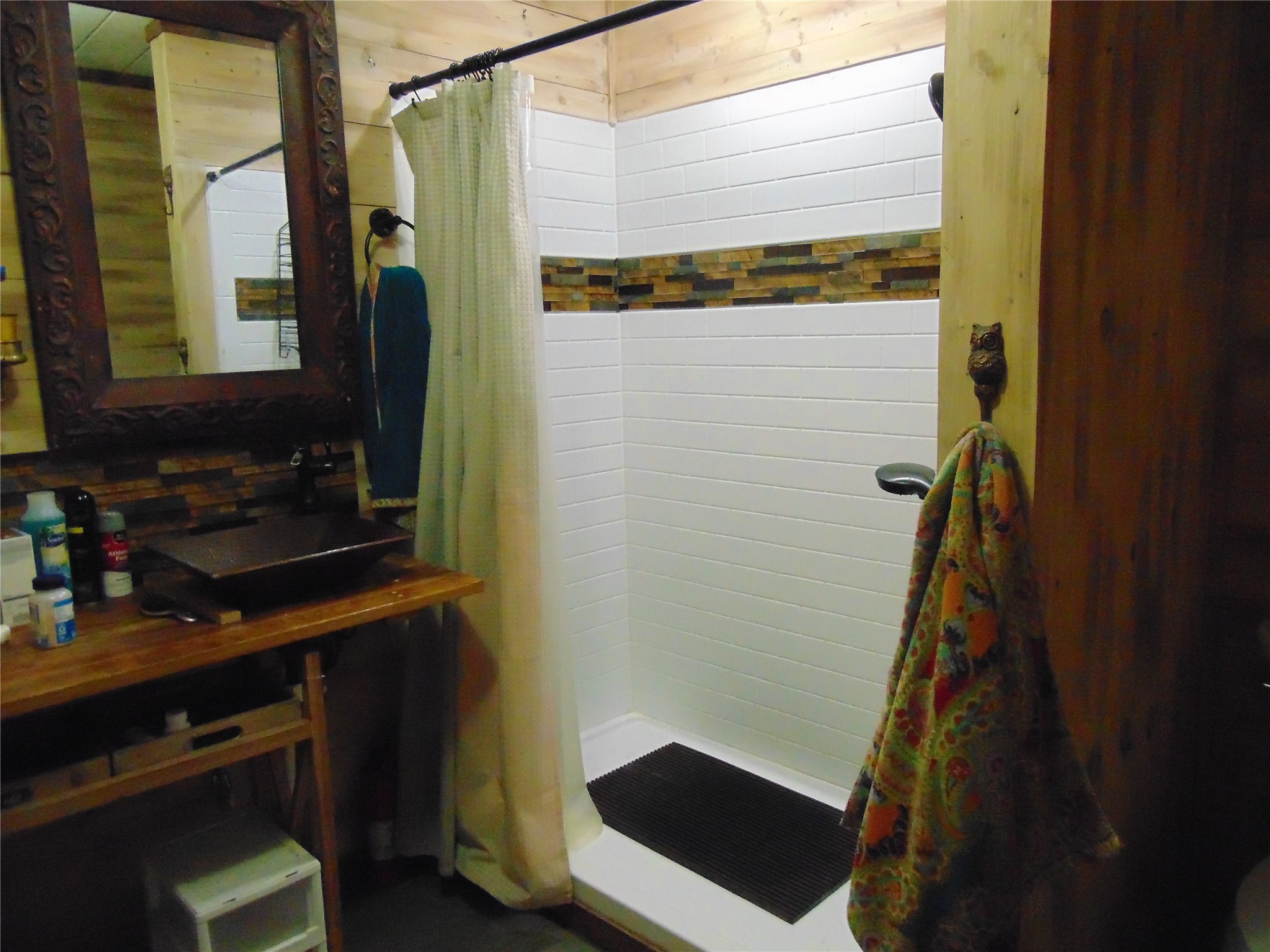 100 West Caroline Street Trinity, TX 75862 - Photo 24 of 28 a bathroom with a sink and a mirror