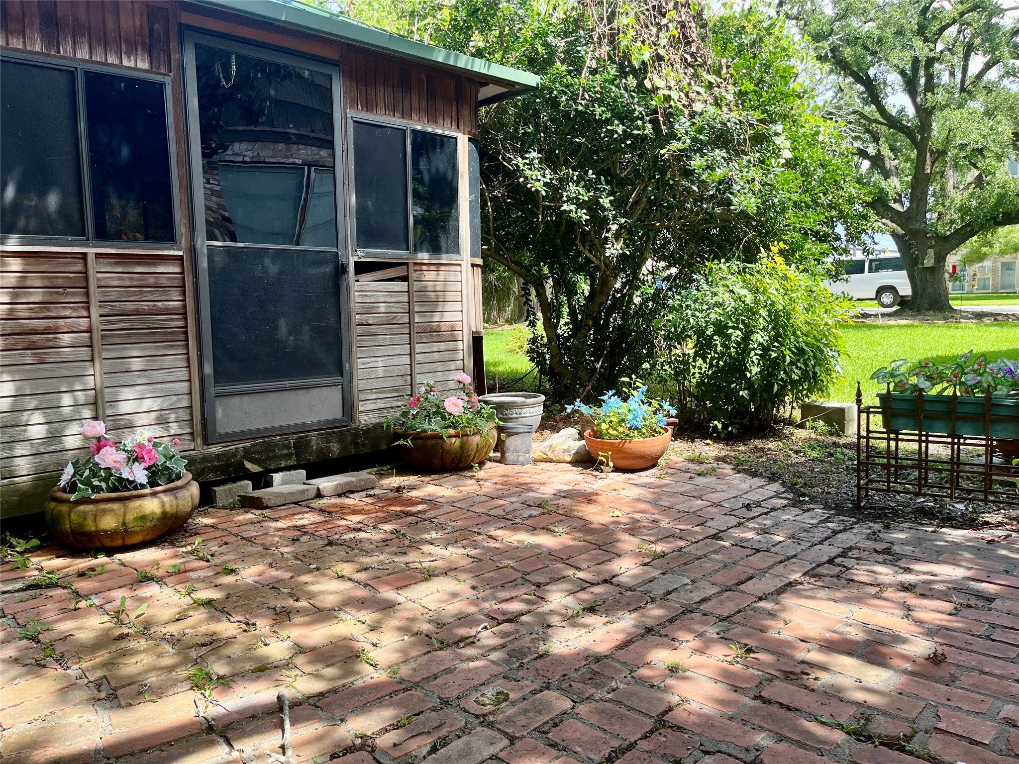100 West Caroline Street Trinity, TX 75862 - Photo 26 of 28 a view of a backyard with chair and tables