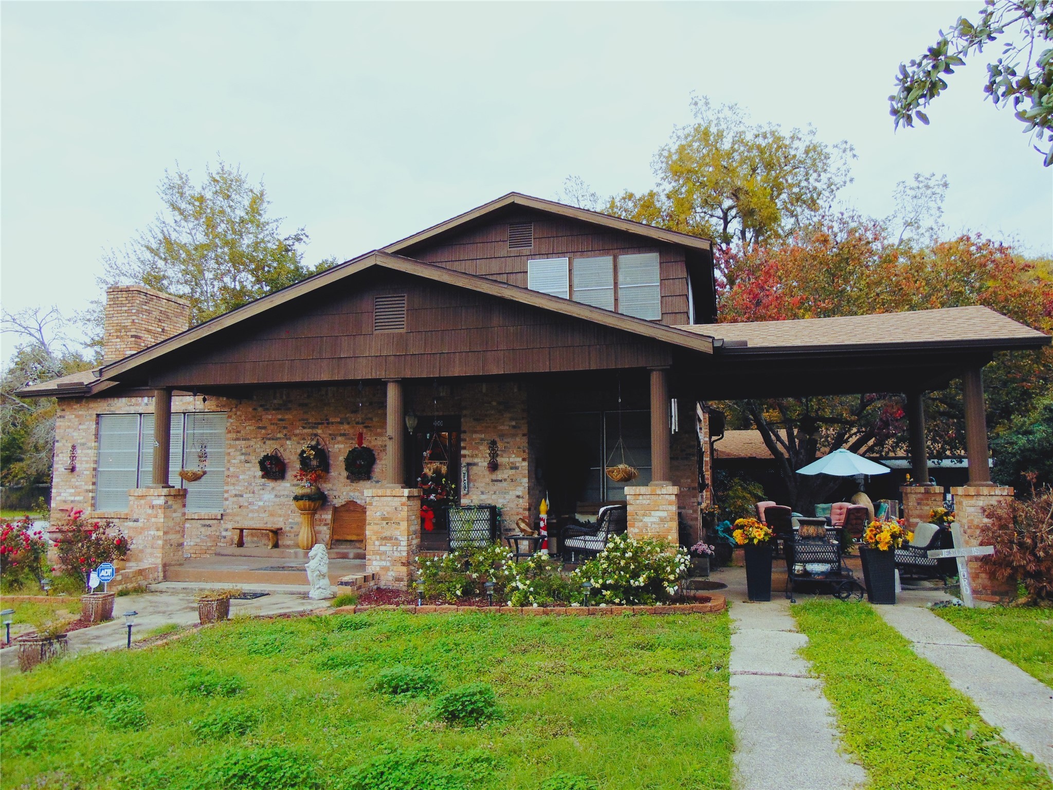 100 West Caroline Street Trinity, TX 75862 - Photo 28 of 28 a view of a chair and tables in the patio and a yard