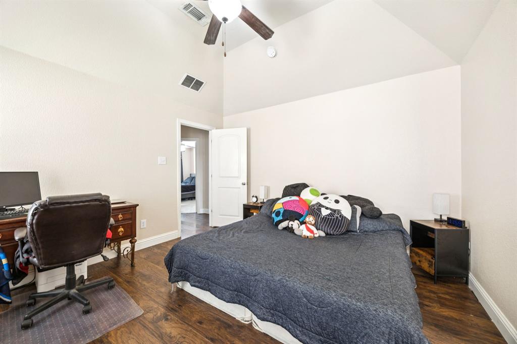 1601 Applegate Way Royse City, TX 75189 - Photo 12 of 28 a bedroom with a bed and cabinets