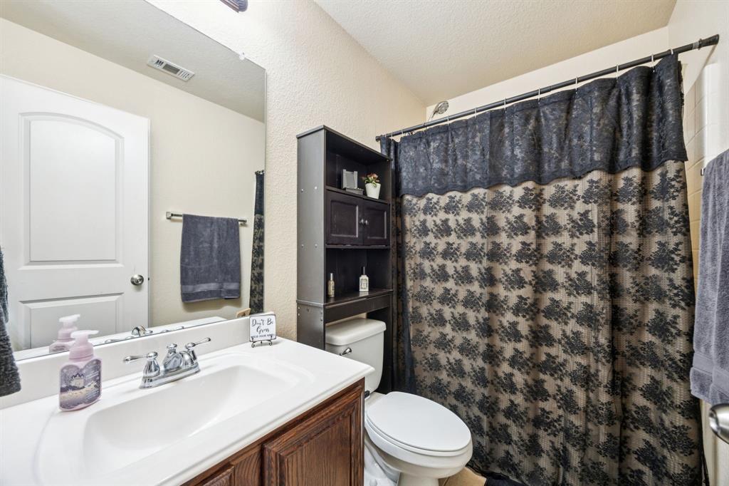 1601 Applegate Way Royse City, TX 75189 - Photo 19 of 28 a bathroom with a sink a toilet and shower