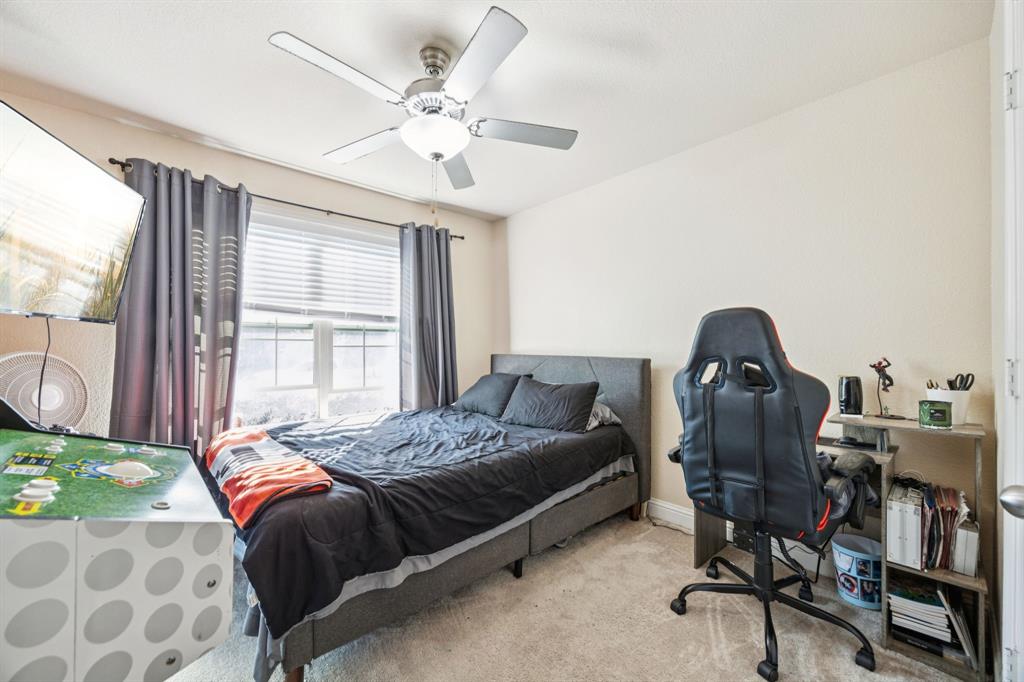 1601 Applegate Way Royse City, TX 75189 - Photo 20 of 28 a bedroom with a bed a chair and a large window