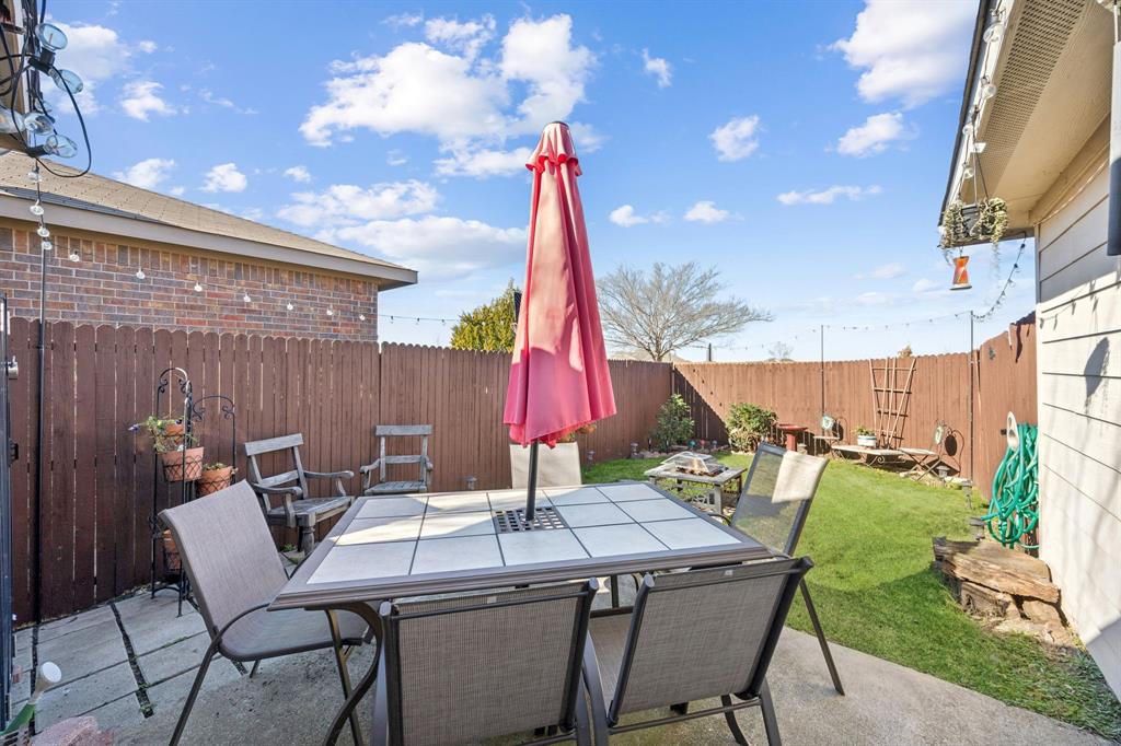 1601 Applegate Way Royse City, TX 75189 - Photo 22 of 28 a view of a patio with a table and chairs