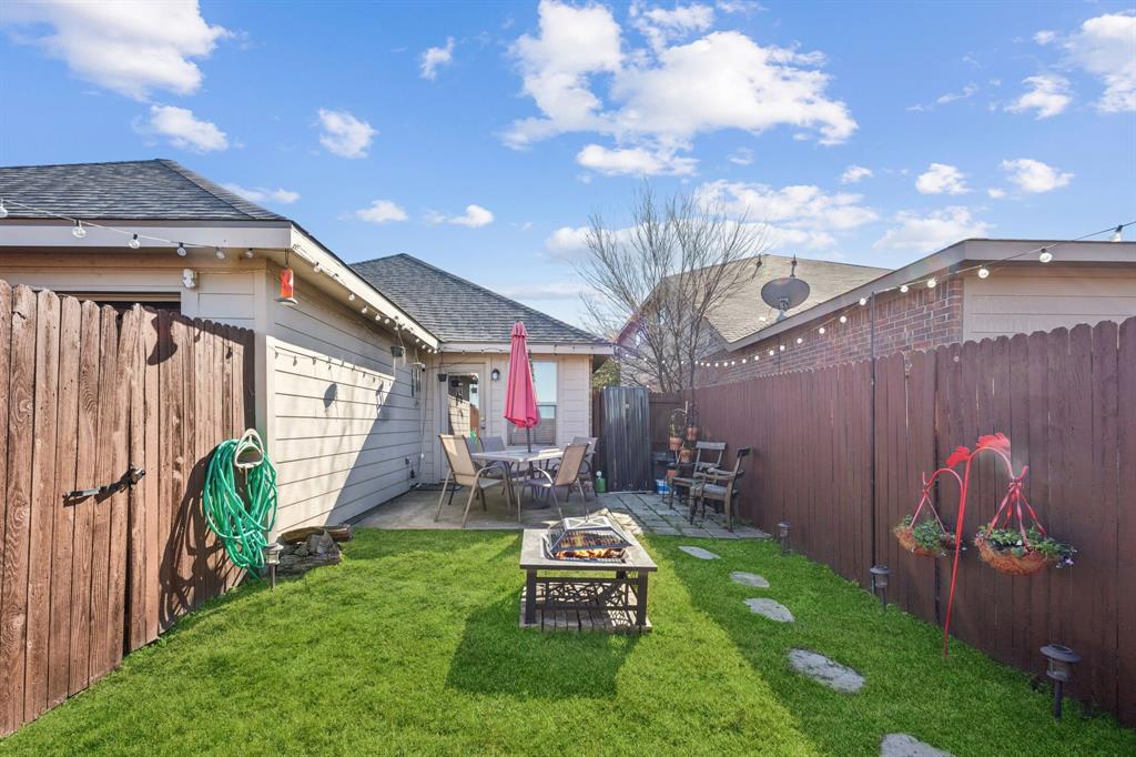 1601 Applegate Way Royse City, TX 75189 - Photo 25 of 28 a view of a chair and table in backyard