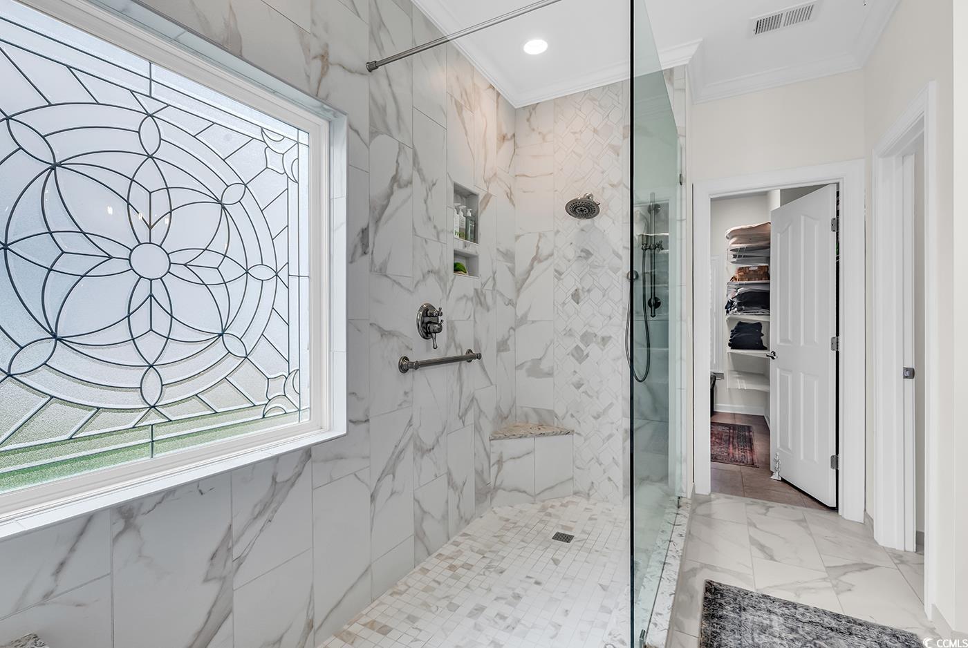 9 Saltwind Loop Murrells Inlet, SC 29576 - Photo 18 of 38 Full bath featuring a marble finish shower, a walk in closet, crown molding, light marble finish flooring, and recessed lighting