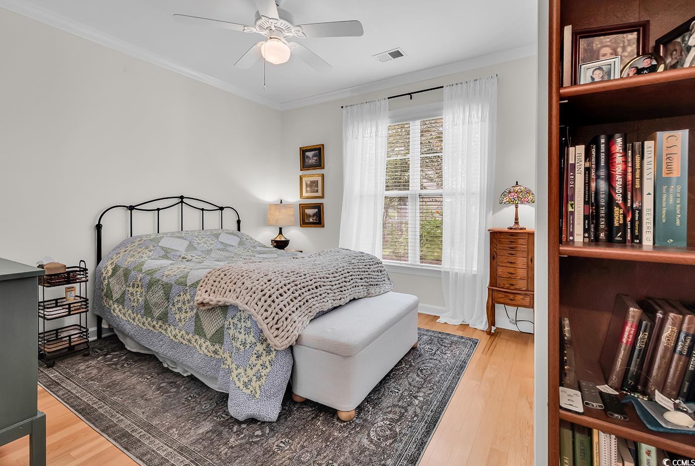 9 Saltwind Loop Murrells Inlet, SC 29576 - Photo 23 of 38 Bedroom with ornamental molding, light wood-type flooring, and a ceiling fan