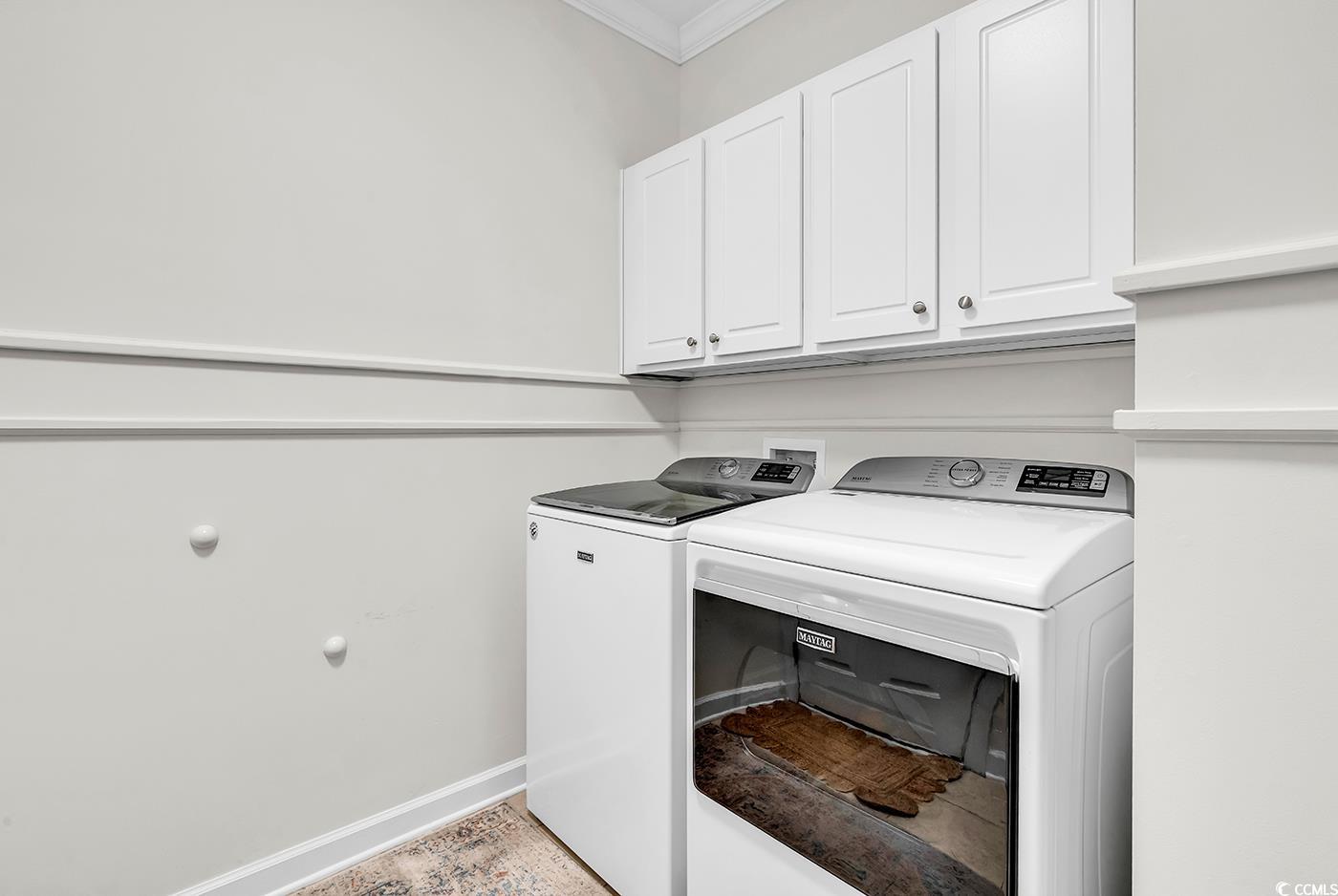 9 Saltwind Loop Murrells Inlet, SC 29576 - Photo 28 of 38 Washroom featuring crown molding, washing machine and clothes dryer, and cabinet space