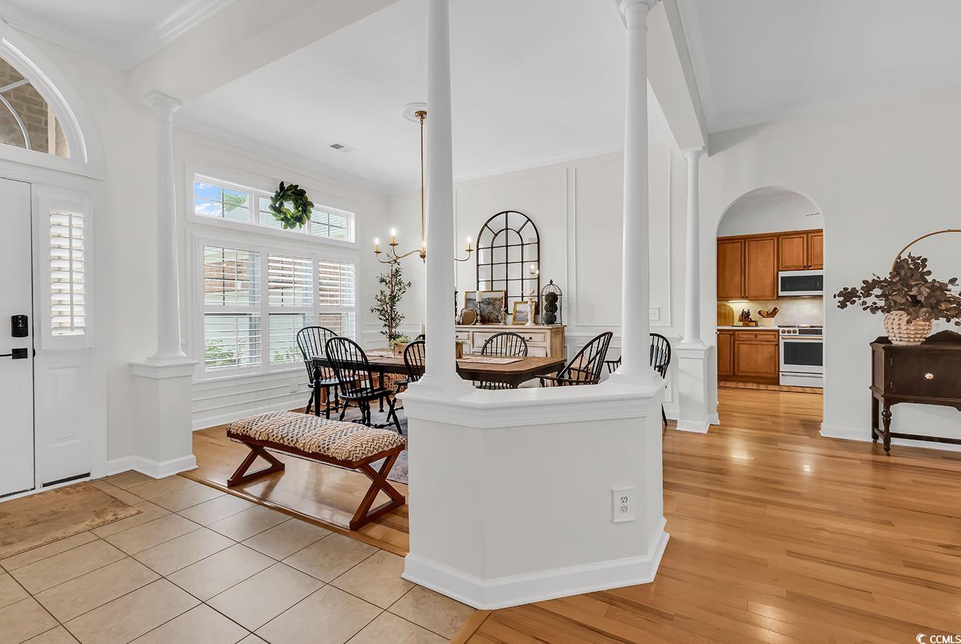 9 Saltwind Loop Murrells Inlet, SC 29576 - Photo 4 of 38 Foyer entrance featuring decorative columns, ornamental molding, light wood finished floors, and arched walkways