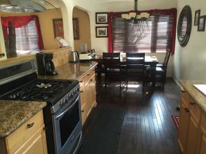 7020 Del Norte Drive Goleta, CA 93117 - Photo 4 of 8 a kitchen with sink stove and cabinets