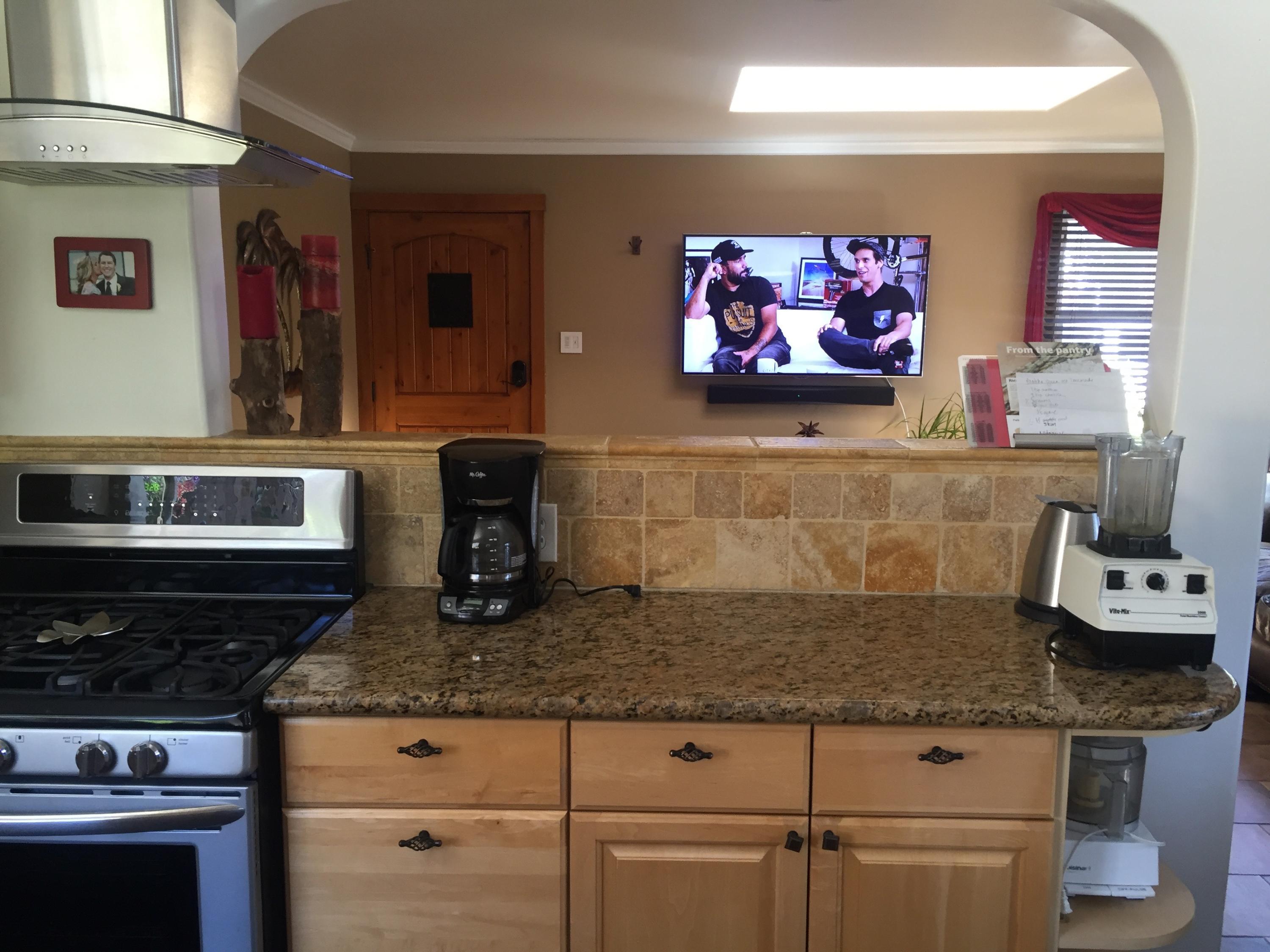 7020 Del Norte Drive Goleta, CA 93117 - Photo 5 of 8 a kitchen with stainless steel appliances granite countertop a stove and cabinets