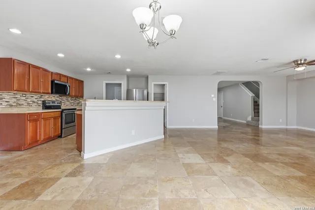 a view of a kitchen with a sink and cabinets