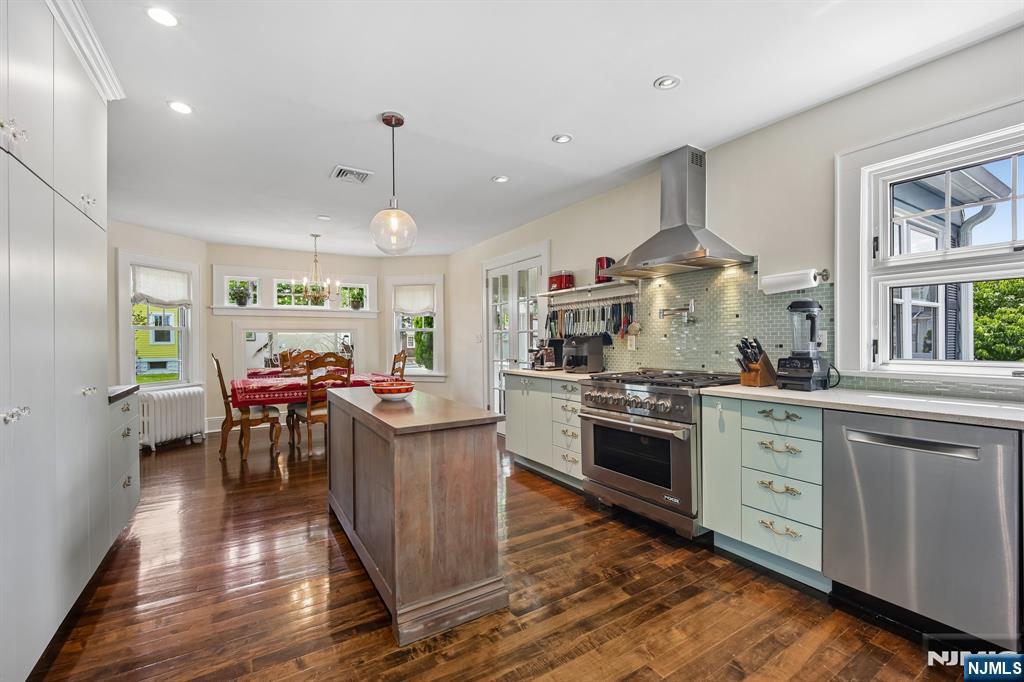 57 Oldis Street Rochelle Park, NJ 07662 - Photo 5 of 19 a kitchen with stainless steel appliances granite countertop a stove oven and a refrigerator