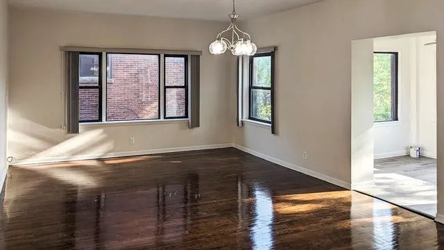 a view of a livingroom with furniture and chandelier