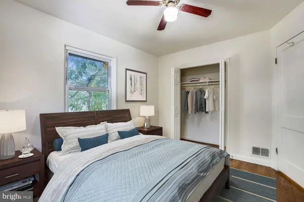 a bedroom with a large bed and a window