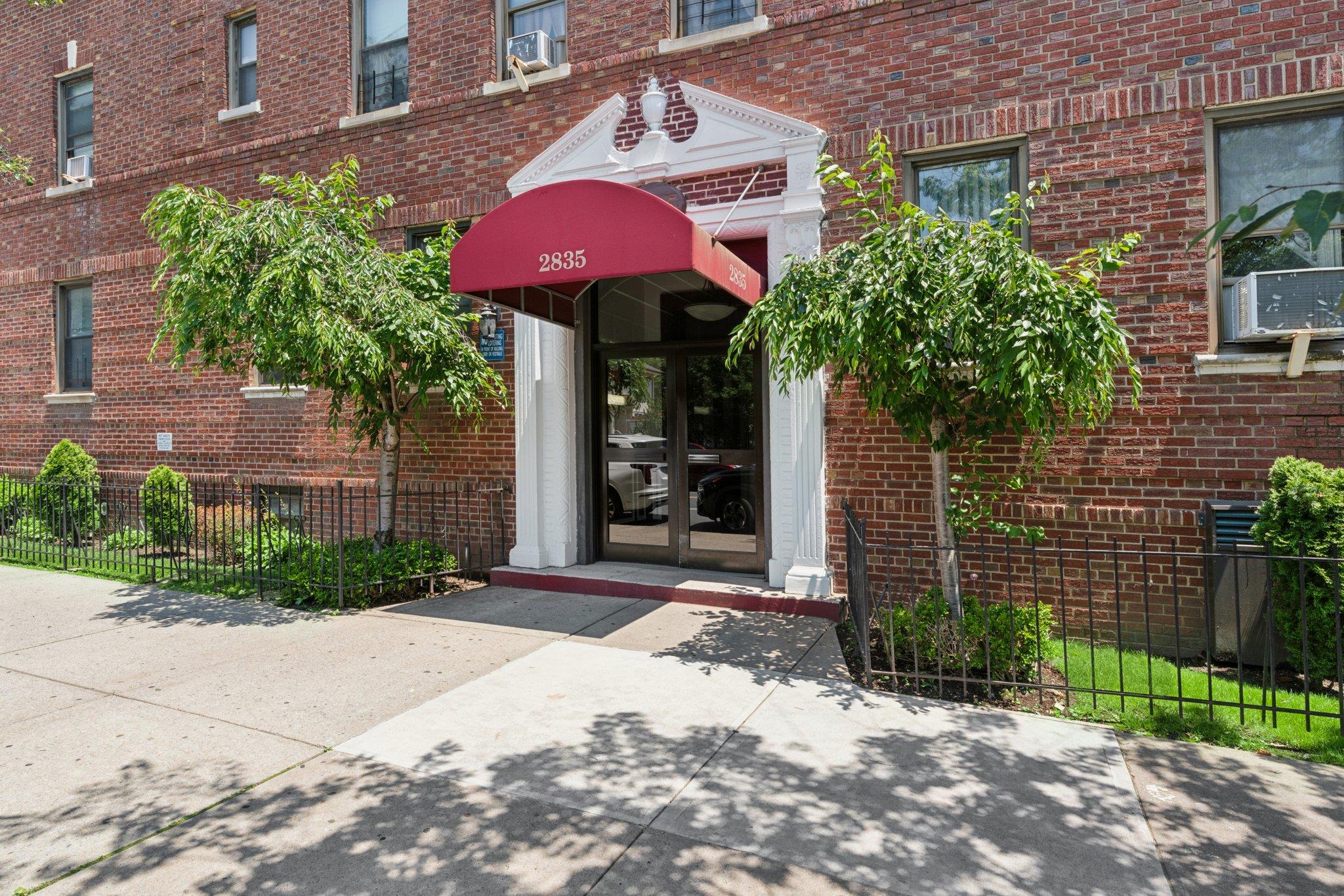 Entrance to property with brick siding