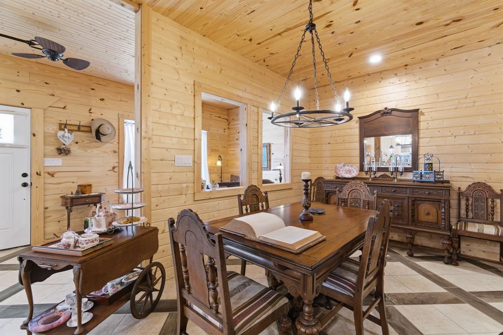 118 Heath Street Hico, TX 76457 - Photo 18 of 39 a view of a dining room with furniture window and wooden floor