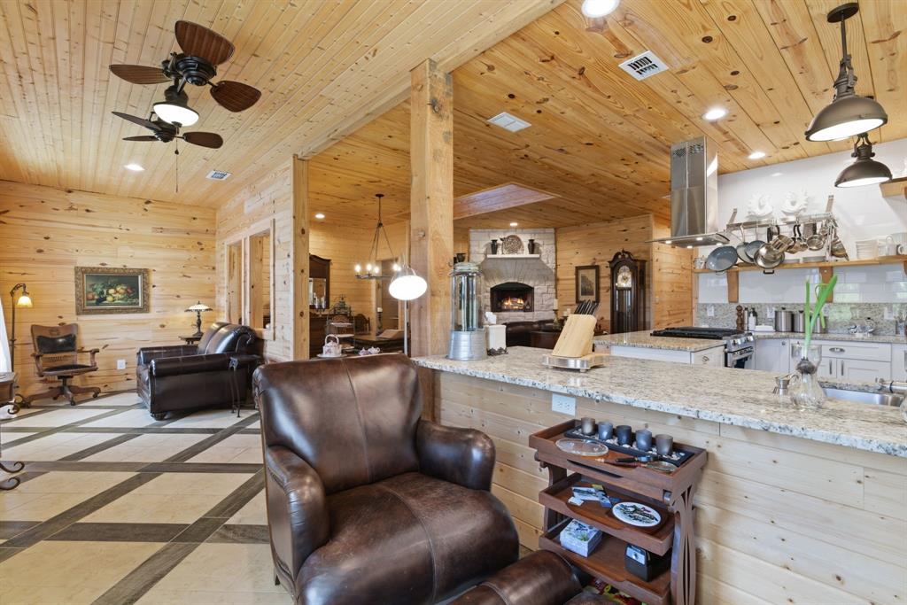 118 Heath Street Hico, TX 76457 - Photo 21 of 39 a living room with furniture a fireplace and a view of living room