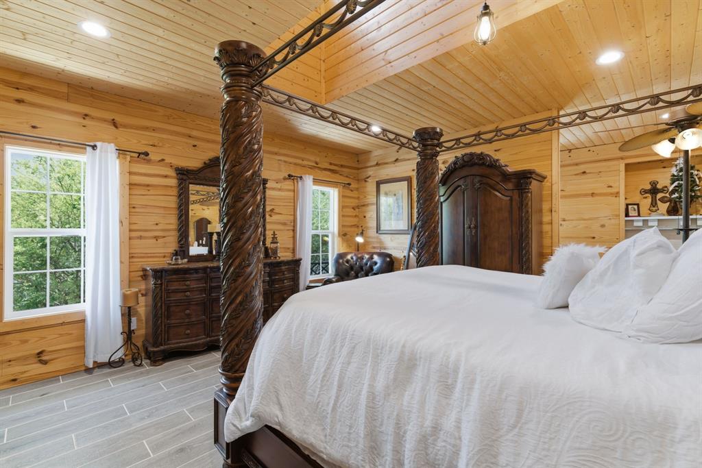 118 Heath Street Hico, TX 76457 - Photo 24 of 39 a bedroom with a bed and a mirror