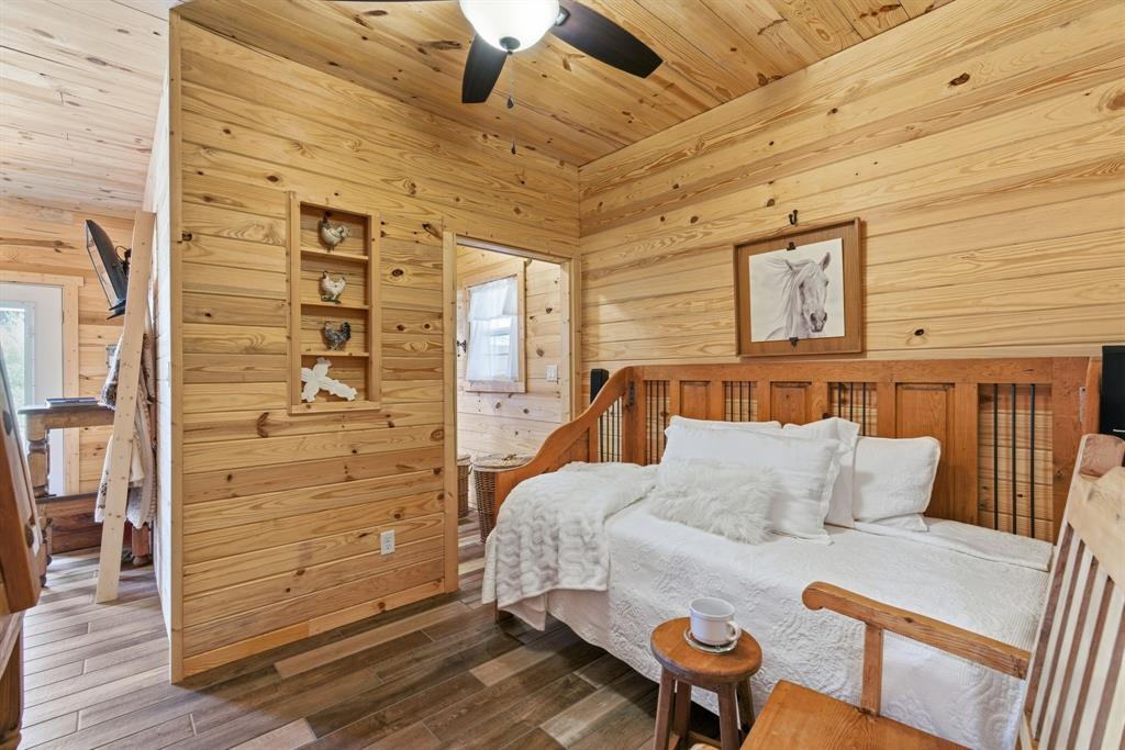 118 Heath Street Hico, TX 76457 - Photo 30 of 39 a bedroom with a bed and wooden floor