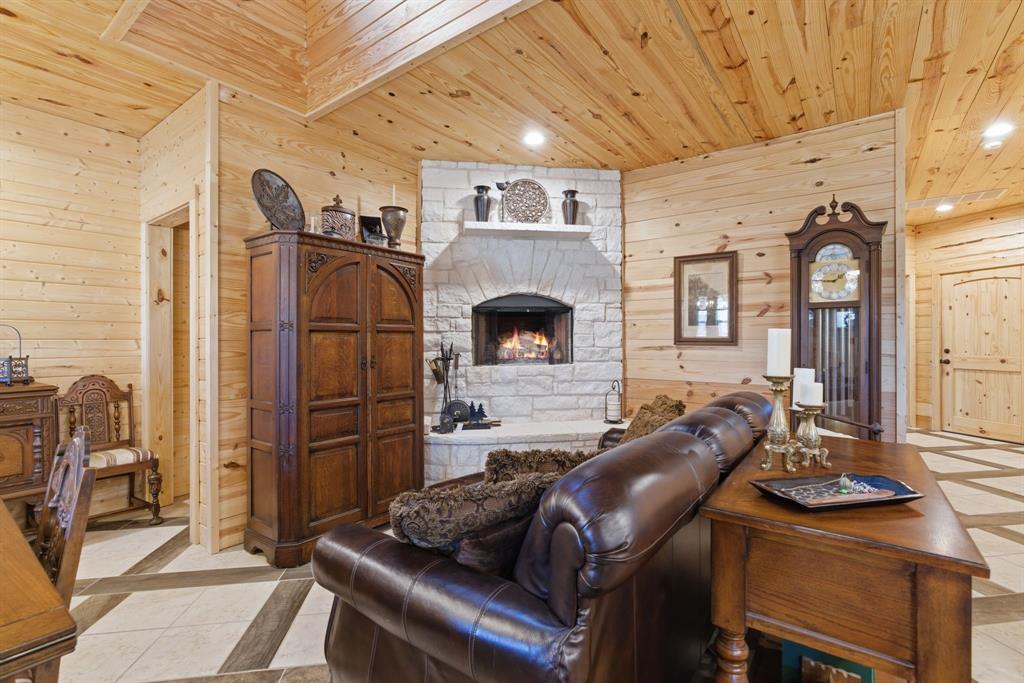 118 Heath Street Hico, TX 76457 - Photo 5 of 39 a living room with furniture and a fireplace