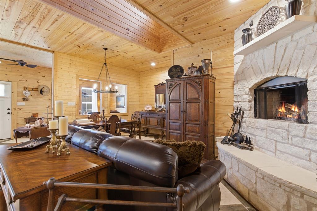 118 Heath Street Hico, TX 76457 - Photo 6 of 39 a living room with furniture a fireplace and large windows