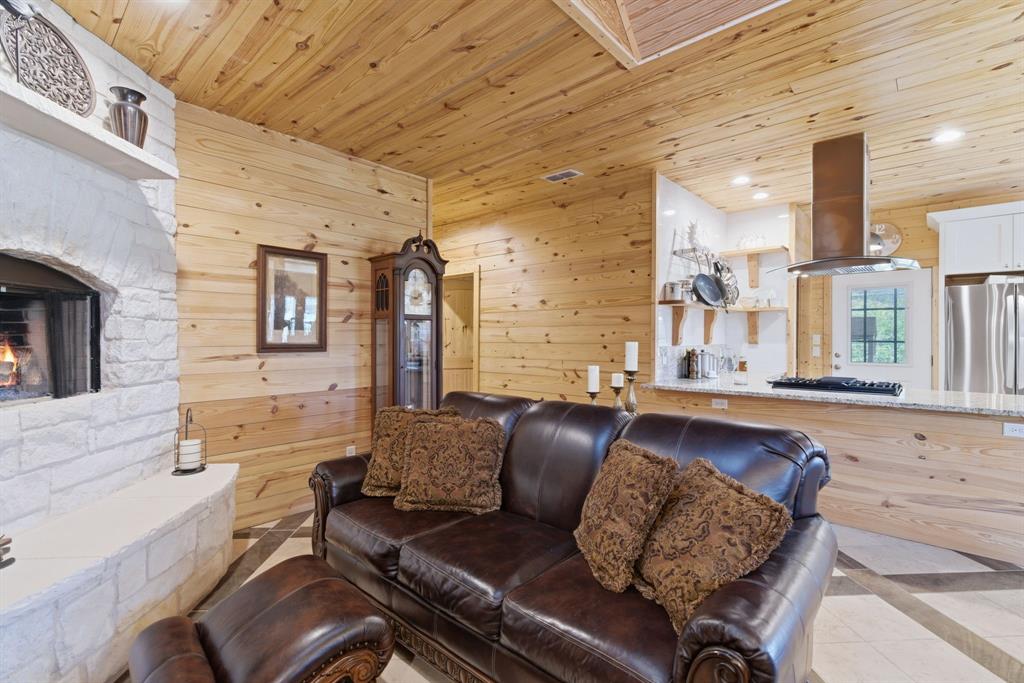 118 Heath Street Hico, TX 76457 - Photo 7 of 39 a living room with furniture and a fireplace