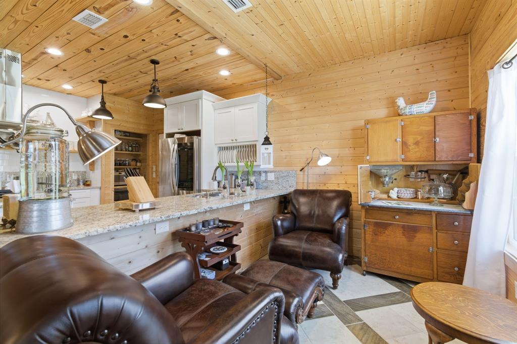 118 Heath Street Hico, TX 76457 - Photo 8 of 39 a living room with stainless steel appliances furniture a rug and a kitchen