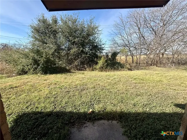 a view of yard with ocean